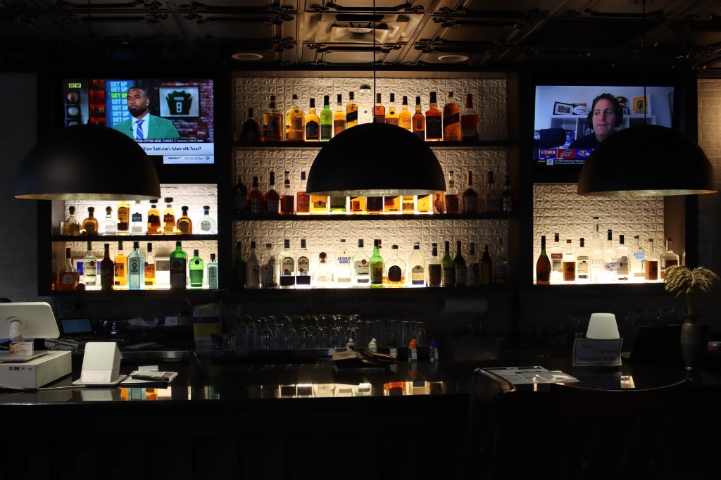 Kanak India full bar with backlit bottles and lounge ambiance